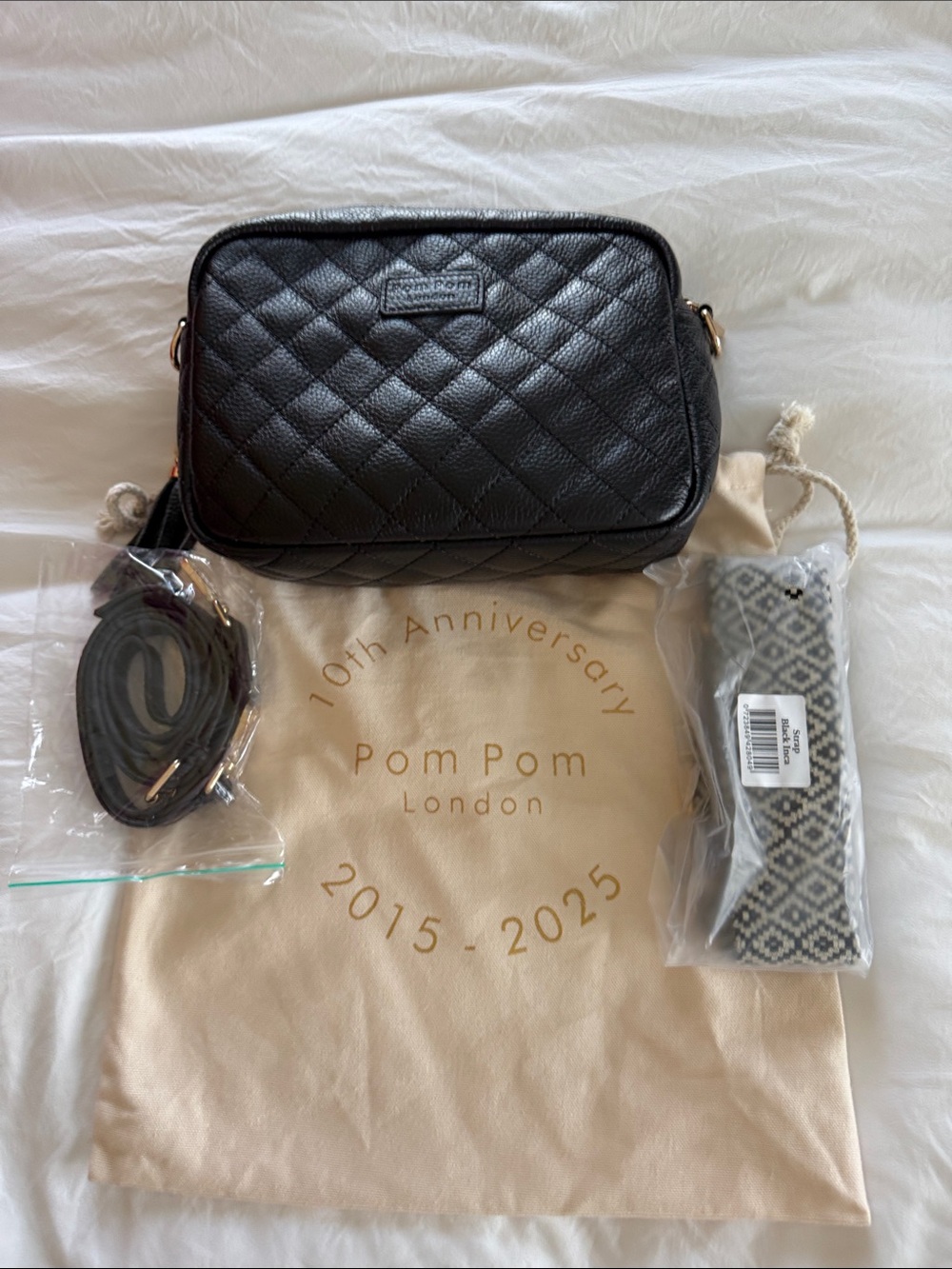 Pom Pom London mini Quilted Black Crossbody Bag with Tassel Accent